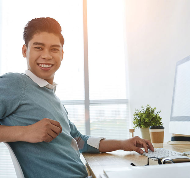 male student working at computer
